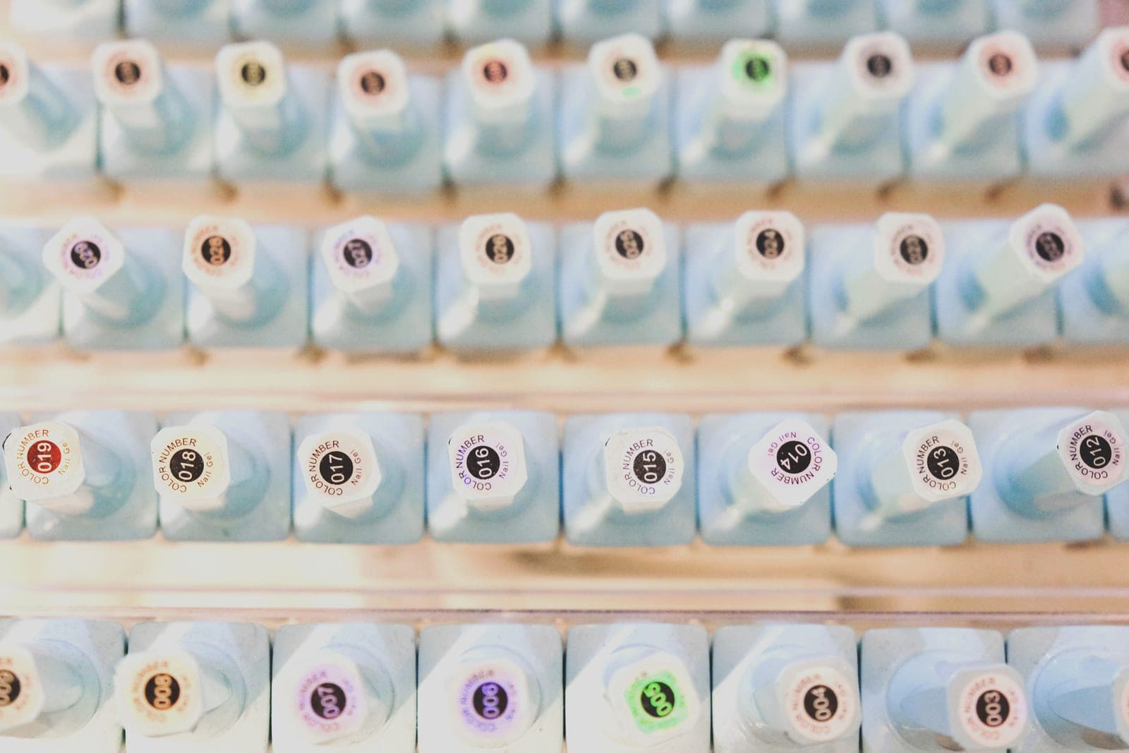 A range of gel polish bottles in assorted colors